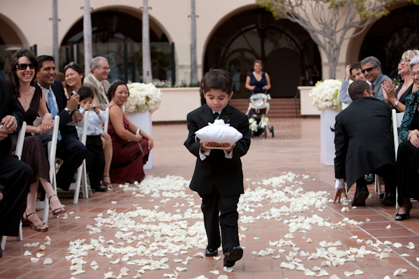 photo by Los Angeles wedding photographer Roberto Valenzuela - adorable ring bearer walking down the aisle